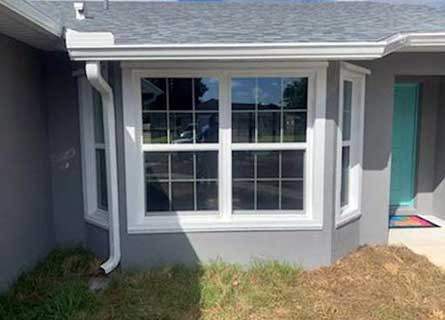 Hurricane panels installed across a wall